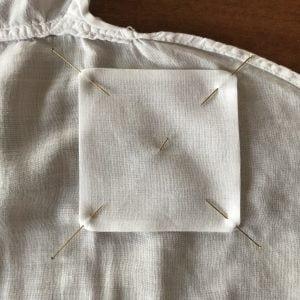 Patch step 1: Pin a patch made of similar cotton lawn to the garment. (c) 2018 Cathy Hay